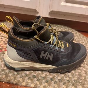 Stylish Helly Hansen women's shoes. Black with yellow accents. Durable and comfo